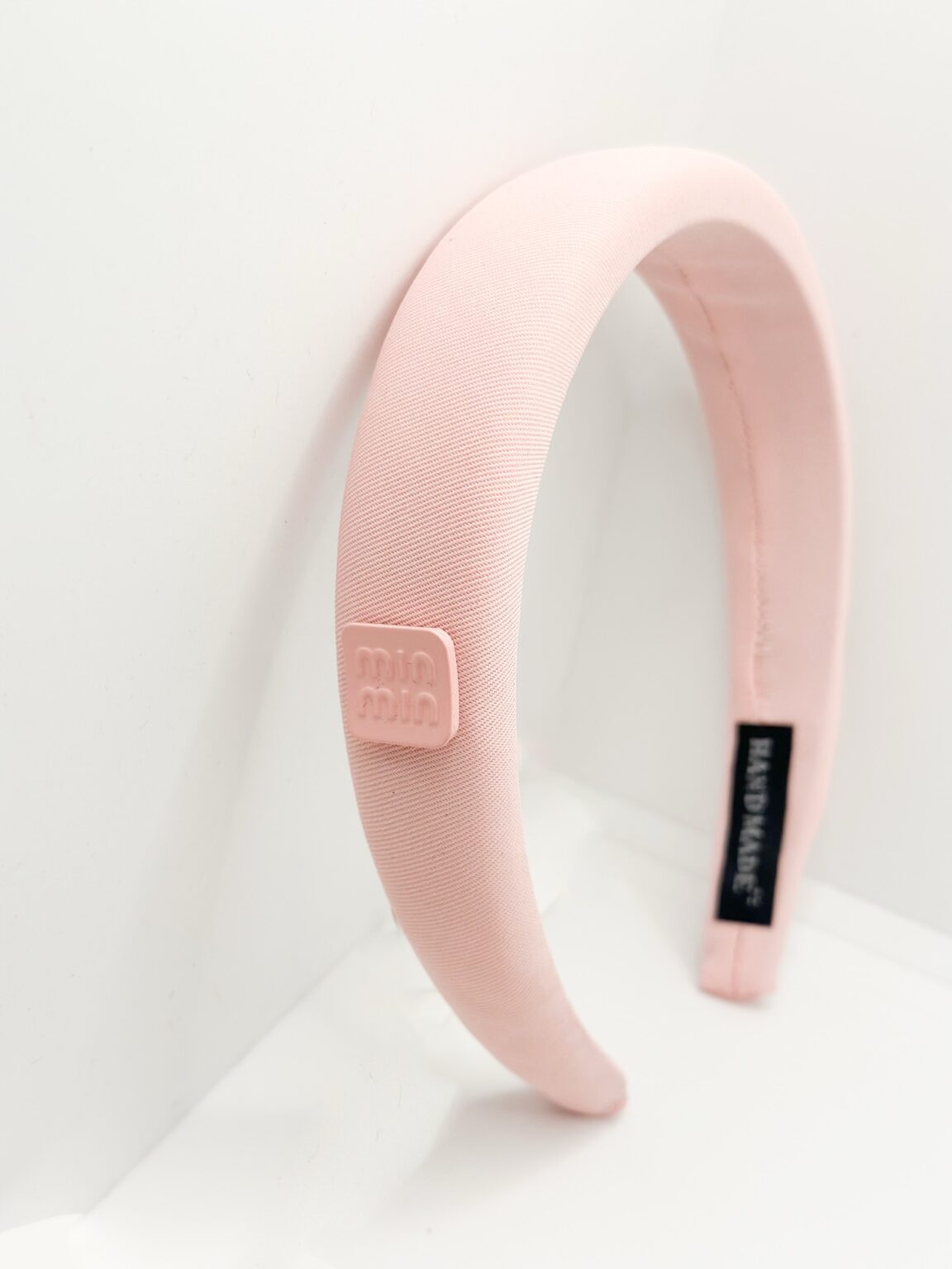 Diadema Miu Miu rosada